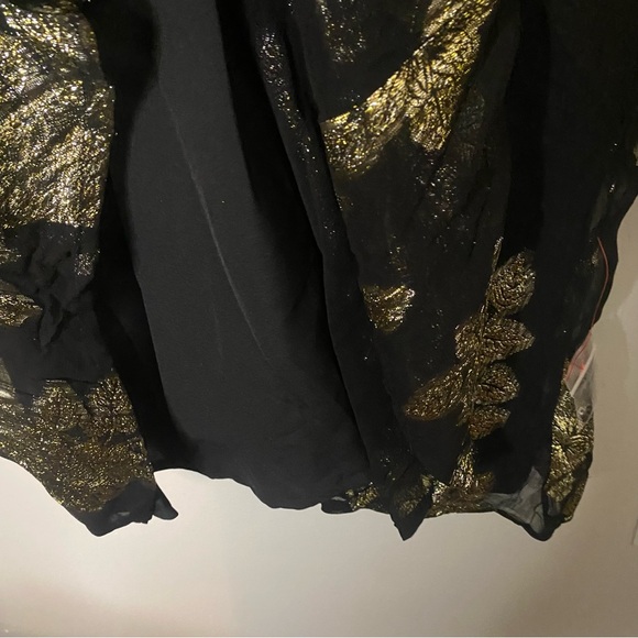 ASOS DESIGN Curve Metallic Frill Mini Dress With Lace Up  Neck In Black Pattern - Picture 13 of 14